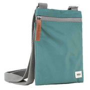 Roka Chelsea Sustainable Nylon Pocket Sling Bag - Sage Green